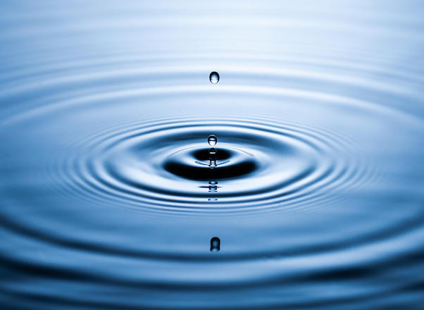 Picture of water dropping into soft water