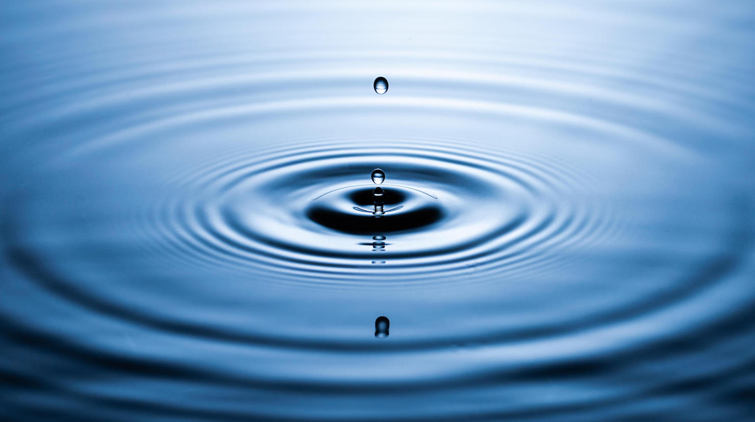Picture of water dropping into soft water